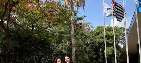 My friend and me in front of the language building on campus for her graduation pictures. Notice the beautiful trees!