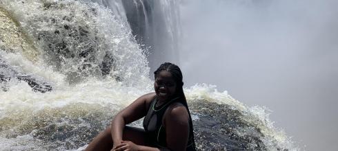 Sitting on the edge of the cliff at Victoria Falls