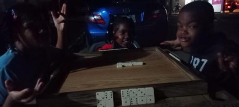Playing Domino with the neighborhood kids