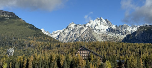 Štrbské pleso, a lake, with the snowy High Tatras in the background.