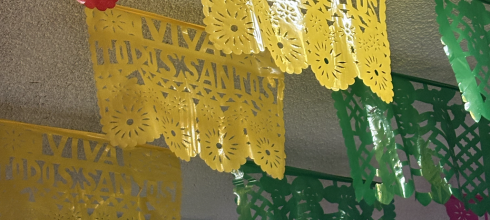 These colorful papers are called papel picado, or perforated paper, and are a traditional Mexican craft typically displayed during holidays. This one hangs year-round with the name of the town, Todos Santos.