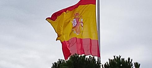 The red and yellow stripes represent national identity and unity with the coat of arms drawn in the middle 