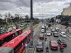 The view of the highway from the bridge that I walk across to get to school showing the red buses are called TransMilenio, which are the public buses in Bogotá