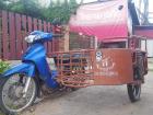 A cool looking motorcycle with a cart