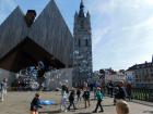 Children playing with bubbles under a sunny sky in Ghent, Belgium