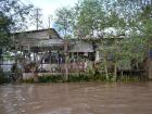 The river goes right up to a lot of houses