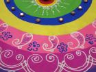 This is a rangoli design. This type of folk art can be found in businesses, in the home and on the streets during Diwali