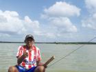 This Wayuu man fishes for shrimp and takes tourists around the marsh!