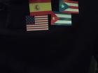 Pictured are the Spanish, US, Puerto Rican, and Cuban flags