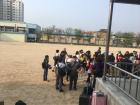 Standing outside the school