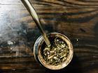 Mate is always drunk with a metal "bombillo" or straw that has a filter for the loose yerba leaves