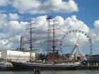 A view of the waterfront, ships and the Ferris wheel