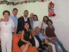 Gabriela and her family at a Christmas holiday party
