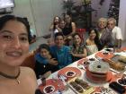 Gabriela enjoying a festive celebratory meal with her family