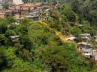 In Medellín, many lower income communities live in basic dwellings in the hills above the city center