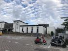 The train station in Guan Shan, with lots of scooters parked outside.