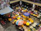 The crowded markets of the city contrast with...