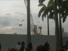 The Singaporean flag being flown overhead