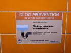 Signs like these are posted by sinks to encourage students to keep common areas clean