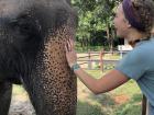 My friend Elly petting our elephant after we returned from our ride through the park