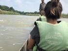 Our canoe ride down the Rapti river heading to the start of the jungle walk; our guide is standing up in the front