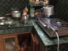 The kitchen in my Jyagata home and the pressure cooker on the stove