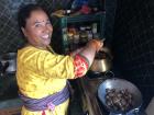 My mom in Jyagata while she's cooking dinner during the Dashain festival