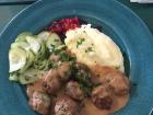 Swedish meatballs and gravy, cucumbers, lingonberries and mashed potatoes