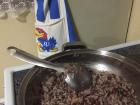 The first dish of gallo pinto my host mom ever cooked for me, featuring her KU Jayhawk apron