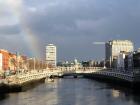 An amazing sight of the river that runs through Dublin with a rainbow 