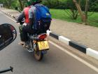 A friend on a boda with his helmet - safety first