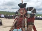 A woman wearing a traditional Mongolian headdress. 