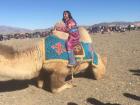 Me nervously climbing onto a camel. 
