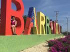 I´m posing by the colorful Barranquilla sign, which welcomes visitors to the city!