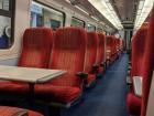 The inside of the train I took to Salisbury where the front rows of seats have tables, but the back ones do not