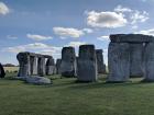 Look closely to see another crow species perched on Stonehenge