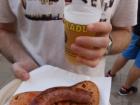 Pan con tomate (bread with tomato) and a sausage at a festival in Catalunya.