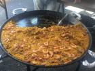This amazing combination of rice and sea food is called "Paella". 