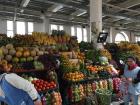 In the market at Cuenca, you can find many fruits and vegetables to eat. Many people come here to buy coconut water, too.