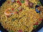 Typical paella with shrimp, mussels, and octopi