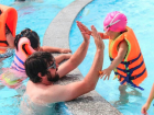 Josh is teaching some of his students how to swim at summer camp in Vietnam.