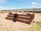Abby sitting on one of the uncovered altars at Tiwanaku