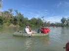 About to paddle into a flooded forest in the Mekong River