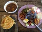 Having good old ayam penyet, but this time with rice that was cooked with a flower (butterfly pea) that turned it blue