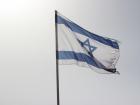 The Israeli flag waving in the beautiful sky