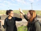 A celebratory high-five after successfully planting three trees