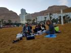 Enjoying some snacks with my host family on the beach of the Dead Sea