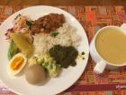 A plate of traditional Rwandan food mixed with other foods