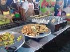 Griddles filled with batter, preparing for filling