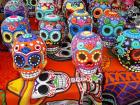 Painted skulls and catrinas, or skeletons, are a popular souvenir as well as an important part of the ofrenda (altar)